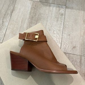 Block heeled open toed sandal. Color is butterscotch